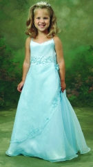 Model wearing a children's gown by Mon Cheri Bridals