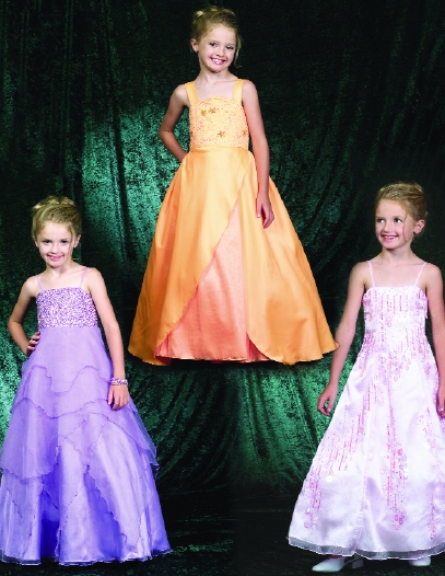 Models wearing children's gowns by Perfect Angel