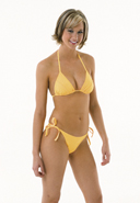Model wearing yellow-orange bikini by Peli Performance Wear