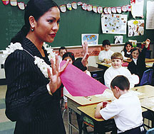 Angela speaks to a classroom