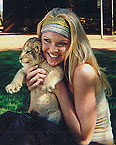 carrie with a lion cub.