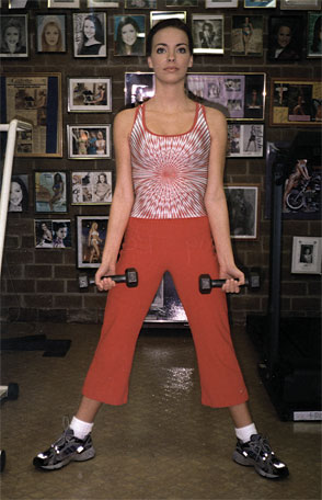 Miss Florida Teen USA 2005 Victoria Ratliff demonstrates combining squats with Bicep Dumbell Curls - Position 1