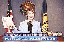 Nicole Johnson speaking at the National Press Club