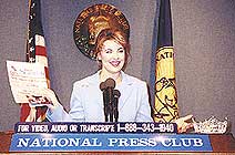 Nicole Johnson speaking at the National Press Club
